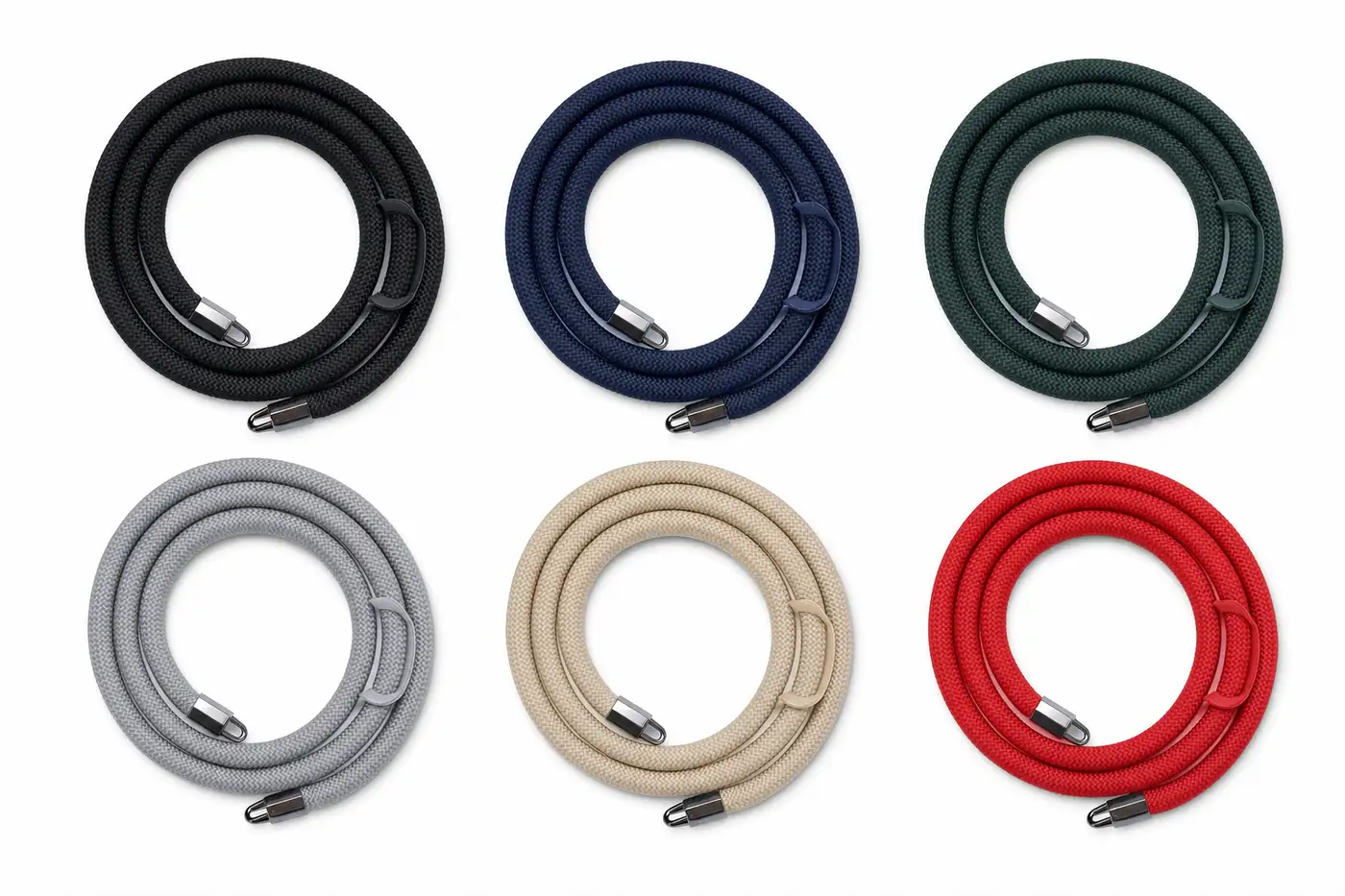 Several camera straps in different colors laid out side by side on a flat surface