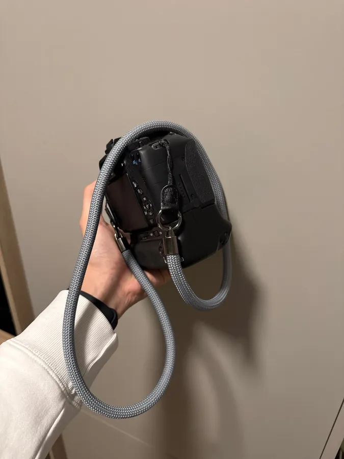 Braided rope camera strap photographed by a verified buyer